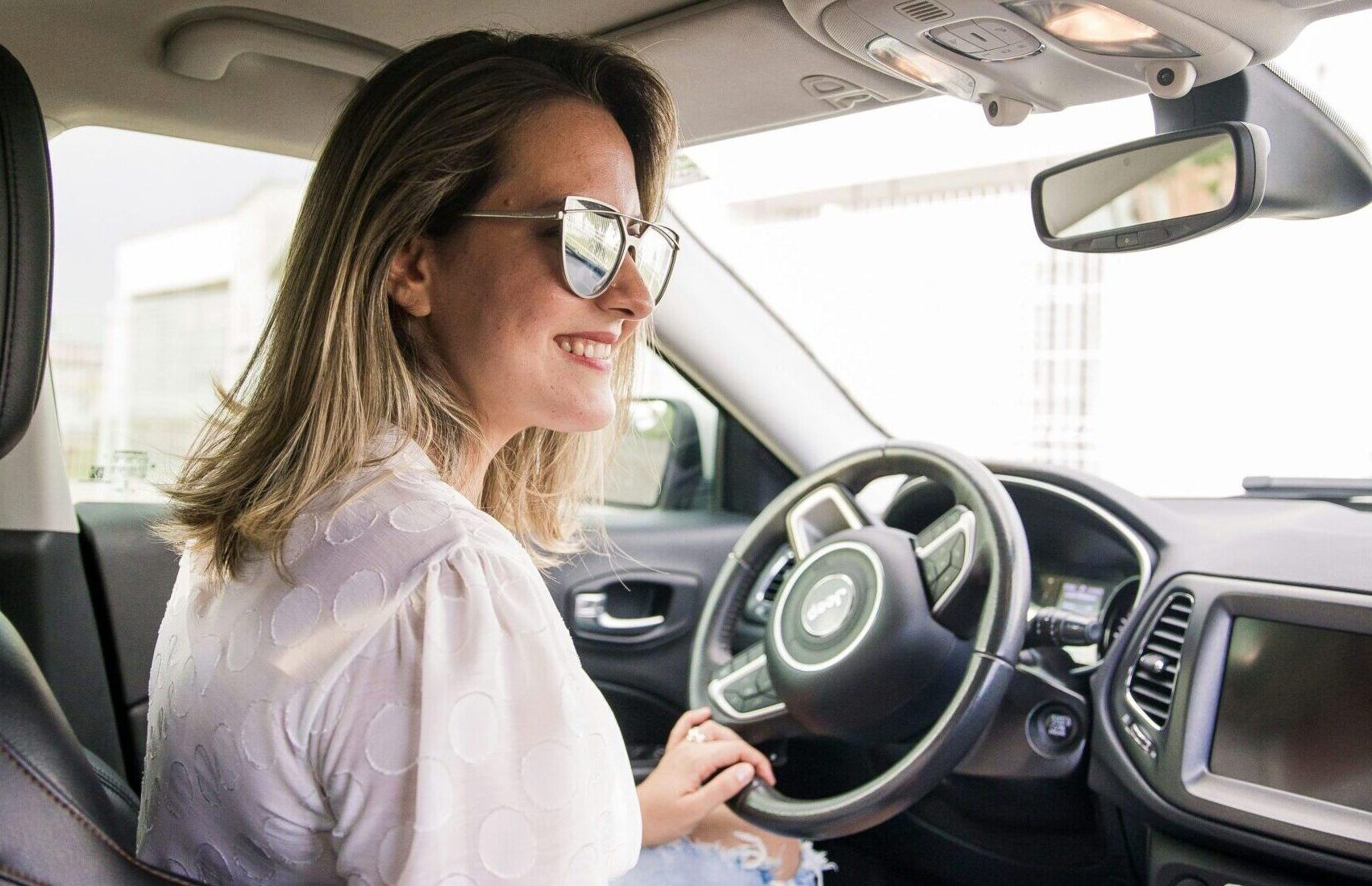 woman driving new car