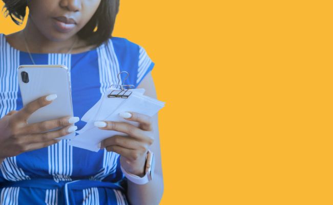 African American woman using smartphone for online financial payment