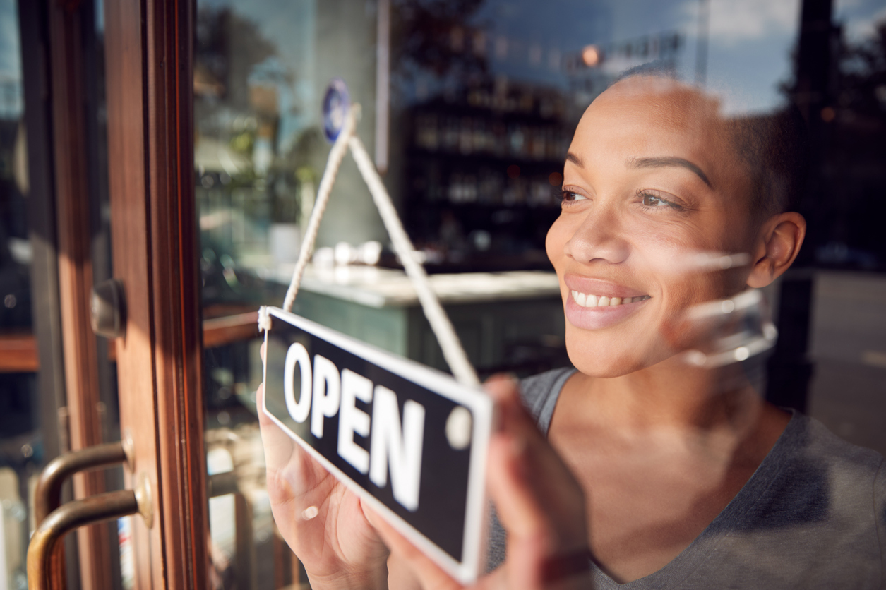 Business owner opens her store, looking forward to another good day