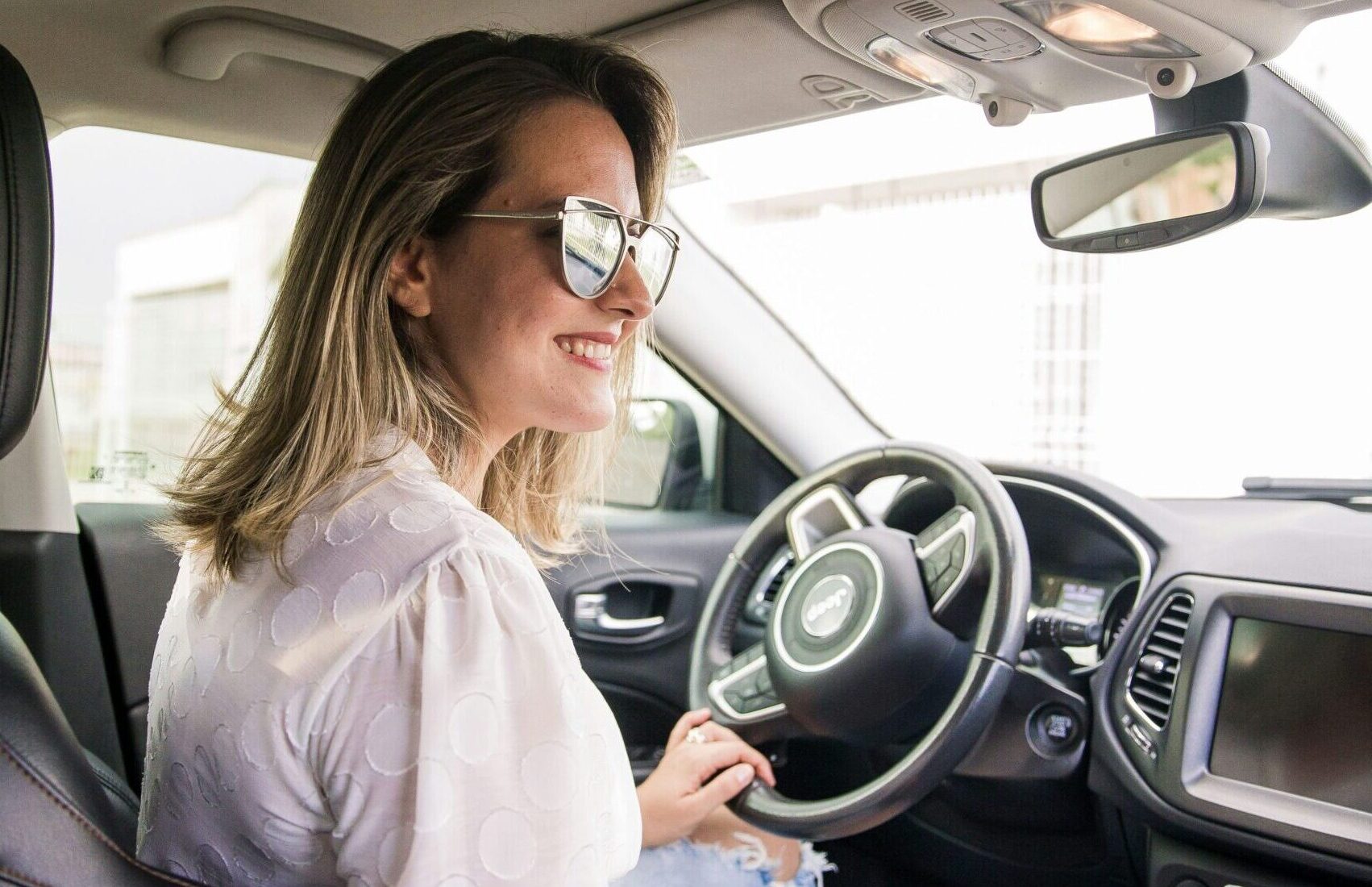 woman driving new car